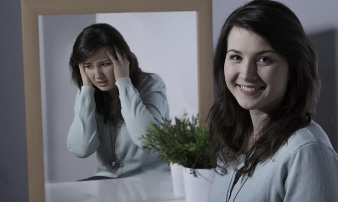 Smiling pretty young girl with bipolar disorder