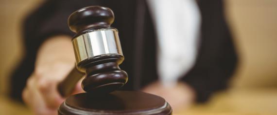 Hand about to bang gavel on sounding block