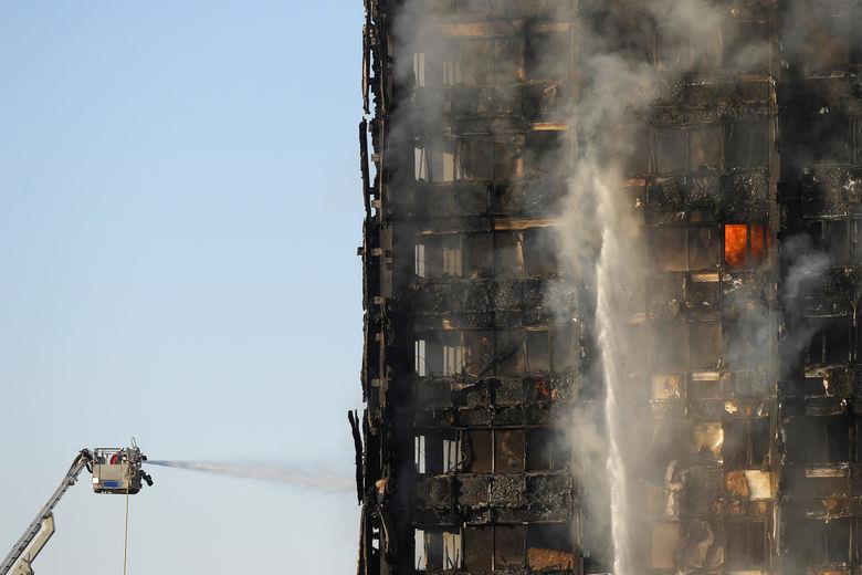 Firefighters deal with a serious fire in a tower block at Latimer Road in West London