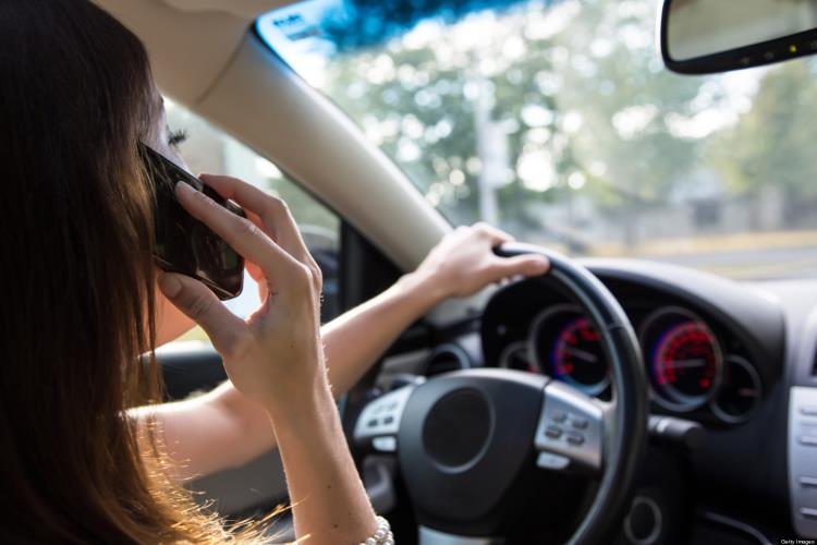 Female driver talking on cell phone