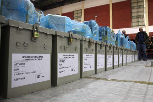 A man stands next to ballot boxes which will be distributed to  civil servants two days ahead of the presidential elections in Nicosia, Cyprus January 26, 2018. REUTERS/Yiannis Kourtoglou