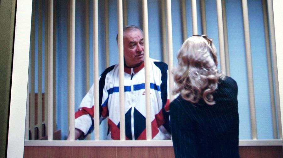 ** FILE ** In this Wednesday, Aug. 9, 2006 file picture Sergei Skripal speaks to his lawyer from behind bars seen on a screen of a monitor outside a courtroom in Moscow.Russian President Dmitry Medvedev has signed a decree pardoning four convicted foreign spies so they can be exchanged for 10 people accused of spying for Russia in the United States, the Kremlin said Friday, July 9, 2010, Sergei Skripal is one of them.(AP Photo/Misha Japaridze)