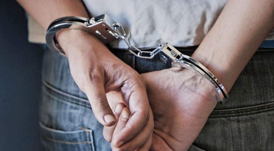 Young man in handcuffs