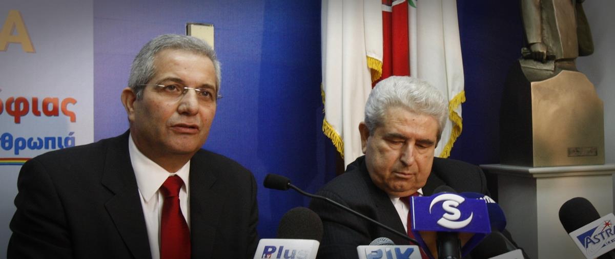 Cyprus President Demetris Christofias speaks to journalists after a leadership contest in his party in Cyprus