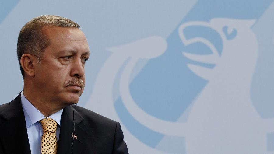 Turkish Prime Minister Erdogan addresses a news conference in Berlin