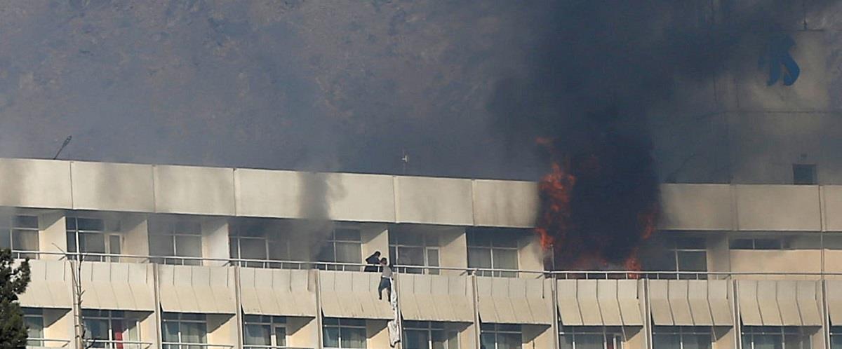 A man tries to escape from a balcony at Kabul's Intercontinental Hotel during an attack by gunmen in Kabul, Afghanistan January 21, 2018. REUTERS/Omar Sobhani