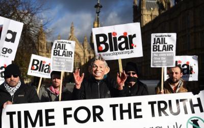 Anti-war campaigners hold protest over the delay in the publication of the Chilcot inquiry report.
