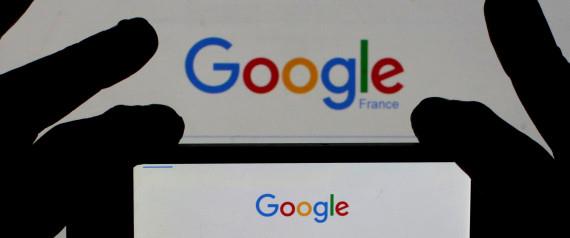 File photo of a woman holding her smart phone which displays the Google home page, in this picture illustration