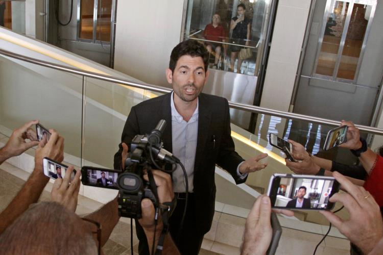 Orestes Fintiklis, managing partner of Ithaca Capital Partners, speaks to reporters at Trump Ocean Club International Hotel and Tower in Panama City