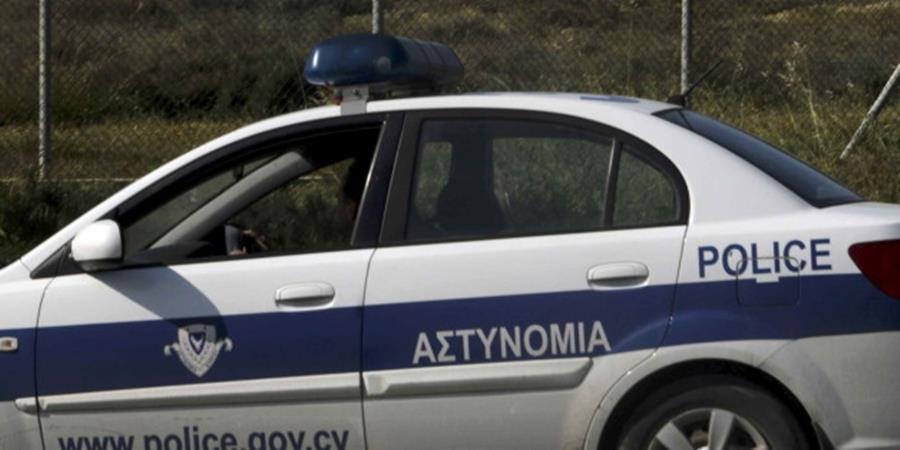 Police stand guard at Larnaca Airport near a hijacked Egyptair A320