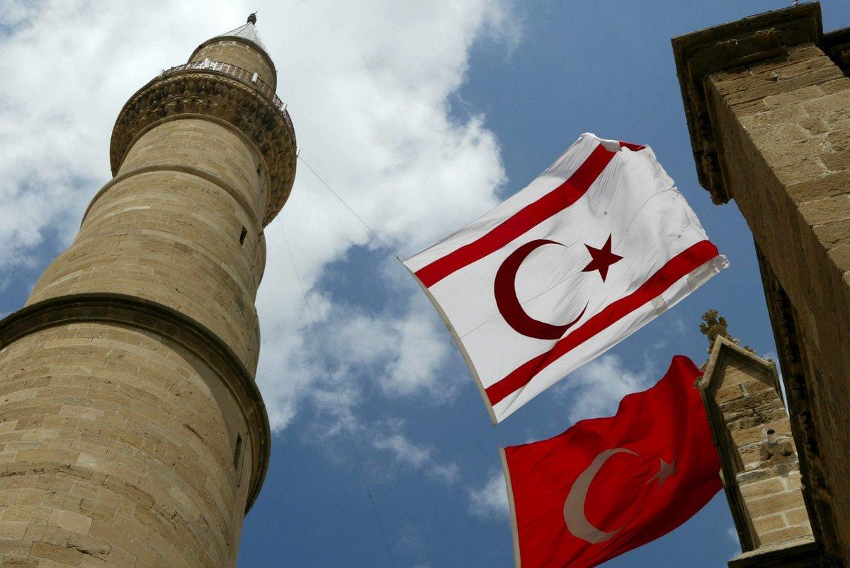 A Turkish flag and the flag of the self-declared Turkish Republic of Northern Cyprus