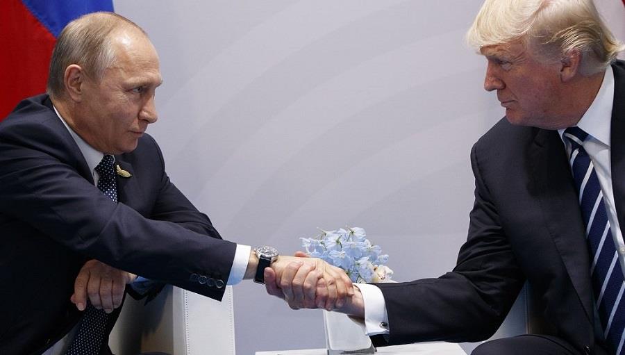 President Donald Trump shakes hands with Russian President Vladimir Putin at the G20 Summit, Friday, July 7, 2017, in Hamburg. (AP Photo/Evan Vucci)