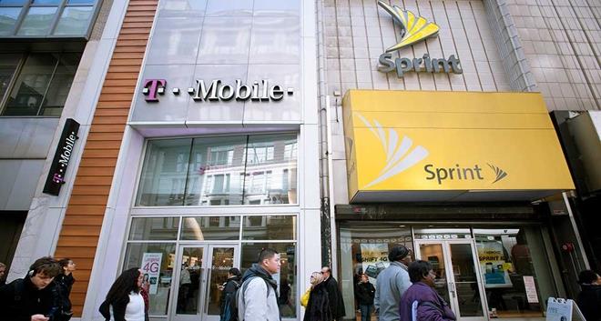 (RICHARD B. LEVINE/Newscom) T-Mobile and Sprint Nextel cellular phone stores adjoin each other in Herald Square in New York on Tuesday, March 8, 2011. Sprint is reported to be nearing an agreement to acquire T-Mobile for $32 billion.
