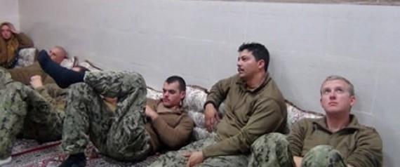 FILE PHOTO - An undated picture released by Iran's Revolutionary Guards website shows American sailors sit in an unknown place in Iran